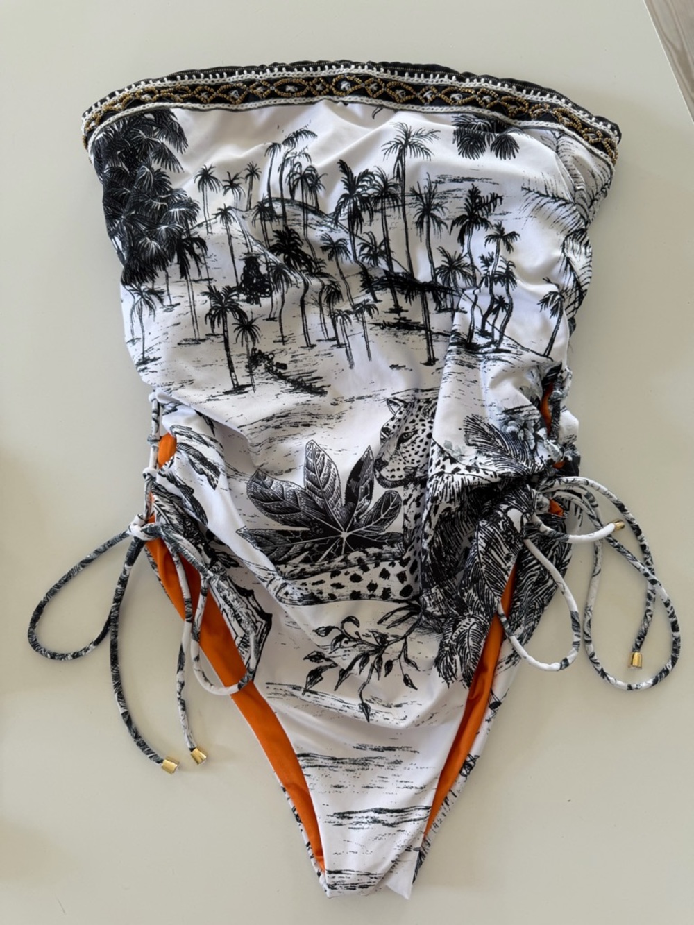 Agua Bendita Black & White Tropical One-Piece Swimsuit with Orange Accents